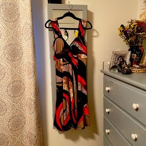 Mid length party dress. Fun and stylish. Very flattering fit!